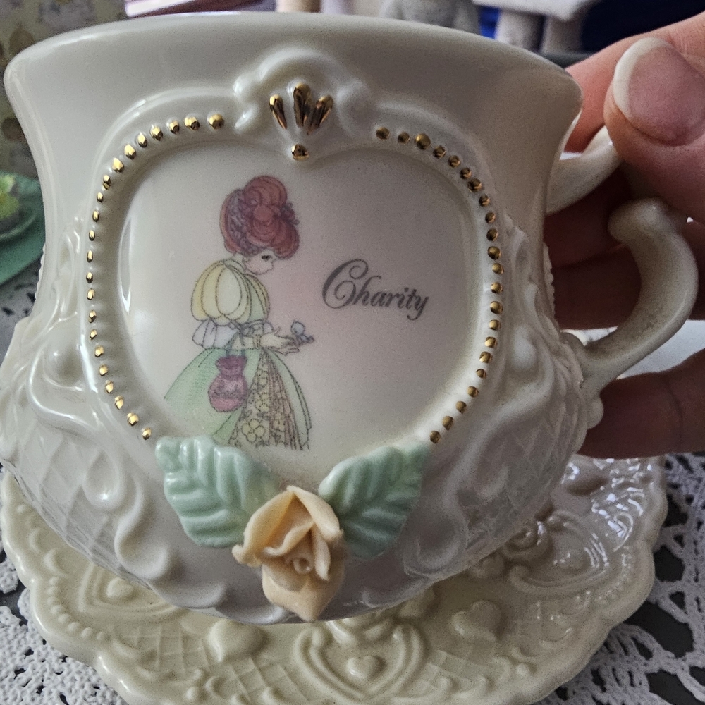 Precious Moments Teacup and saucer "Charity"  no box